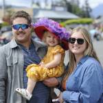 Sequim Gazette photo by Matthew Nash/ Port Angeles Riley and Sonja Hannam hold their two-year-old daughter Summer during the Grand Parade. The couple said they come watch every year.