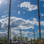 Sequim Gazette photo by Emily Matthiessen/ Contestants in last weeks Sequim Log Show climb 60 foot tall poles and compete at sawing speed.