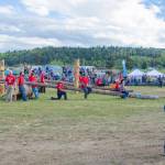 Sequim Gazette photo by Emily Matthiessen/ Contestants in Sequims Log Show watch other contestants climb 60 foot poles last weekend.