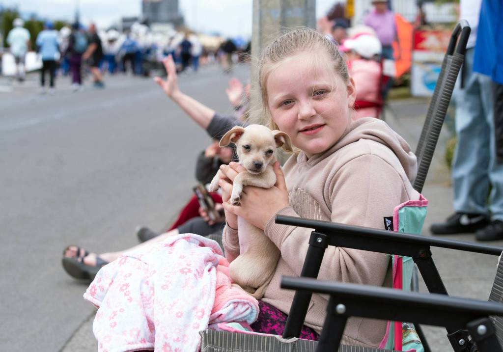 Sequim Gazette photo by Emily Matthiessen
Kyleigh Johnson, 9, and Claire, 7 weeks, had a good spot for the Irrigation Festival Grand Parade.