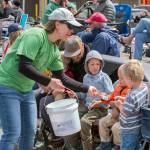 Sequim Gazette photo by Emily Matthiessen/ North Olympic Library staff and volunteers in this years special tee-shirt handed out candy to children in the crowd during Sequims Irrigation Festival Parade.