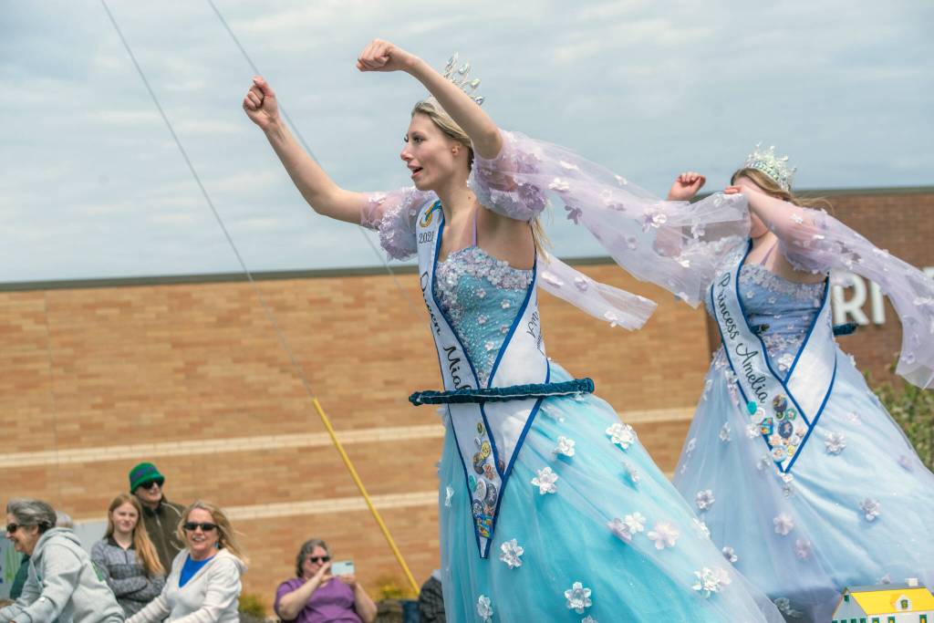 Sequim Gazette photo by Emily Matthiessen/ The Fathoms of Fun Queen Miah Strombach from Port Orchard dances to wild music atop her float with a princess behind.