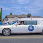 Sequim Gazette photo by Emily Matthiessen/ The last car in the lineup at the Parade was a hearse from Sequim Valley Chapel.