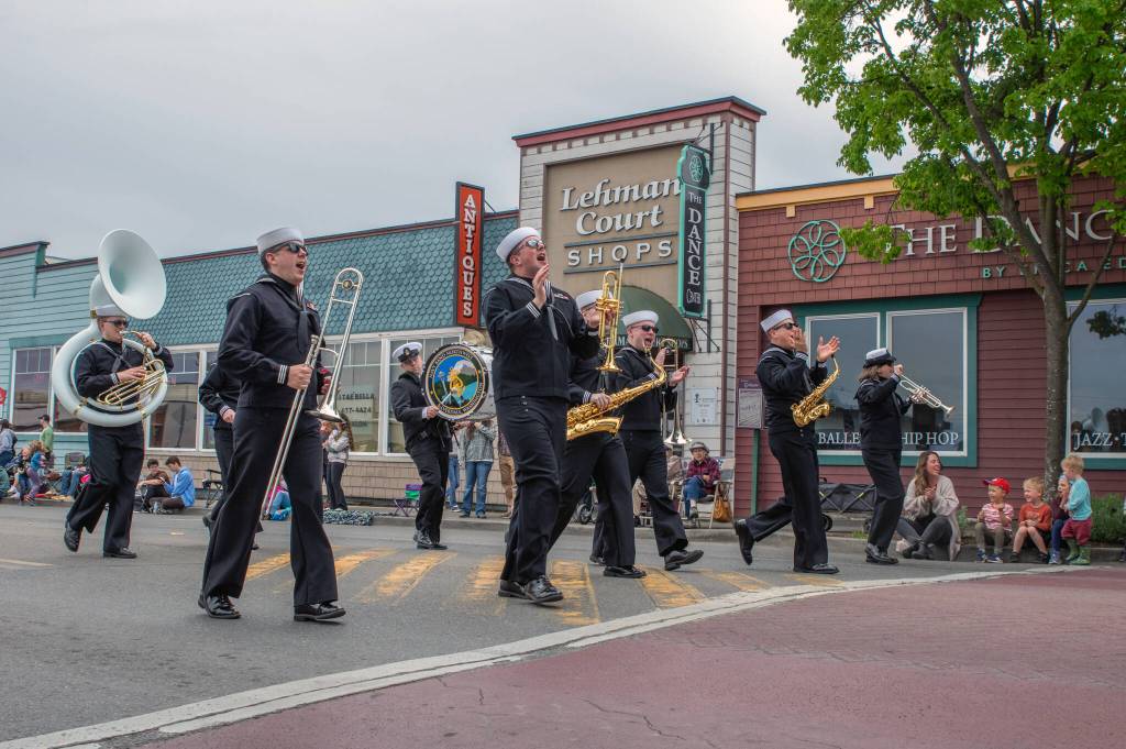 Sequim Gazette photo by Emily Matthiessen/ The Navy band Northwest grooves past admiring children during the Grand Parade in Sequim last Saturday.