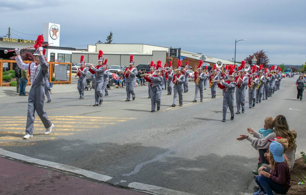 Sequim Gazette photo by Emily Matthiessen/ Hoquiam High Marching Band wends its way down Wash. St. during the Grand Parade in Sequim last Saturday.