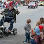 Sequim Gazette photo by Emily Matthiessen/ A Shriner greets children during the Irrigation Festival Parade.
