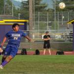 Sequim Gazette photo by Emily Matthiessen/ Adrian Mendez looks to make a big kick against North Kitsap on May 6.