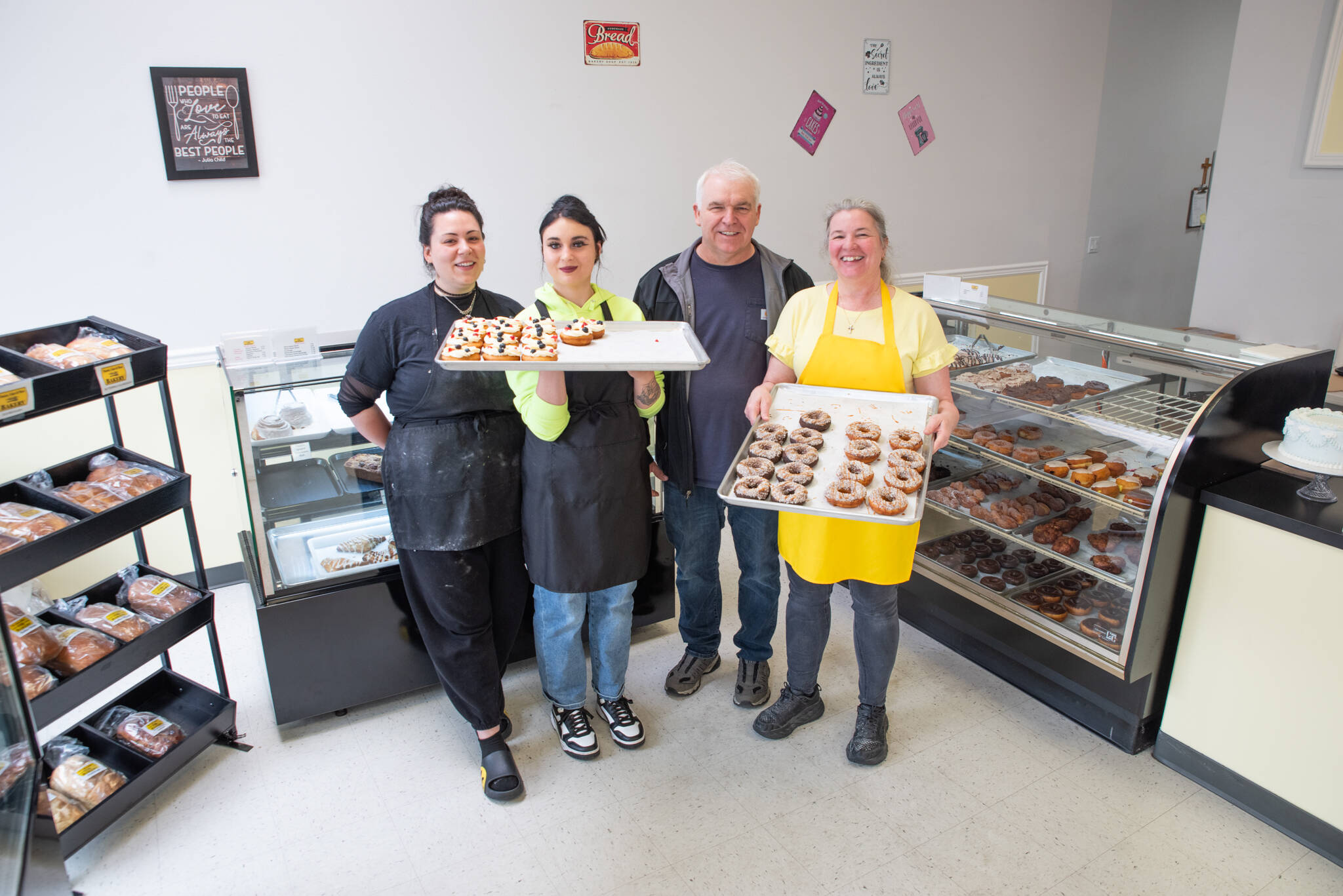 Sequim Gazette photo by Emily Matthiessen
From left, Jordan Prieto, Maggie Thayer, Tom Shaw and Laura Shaw of Donuts, Cakes and More Bakery in Sequim show off some of their tasty treats. Located at 171 W. Washington St., the bakery is open Tuesday-Saturday.