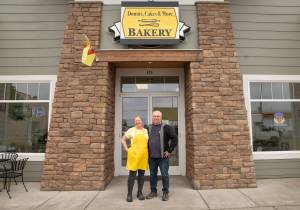 Sequim Gazette photo by Emily Matthiessen
Laura Shaw stands with husband Tom Shaw outside her Donuts, Cakes and More Bakery at 171 W. Washington St. in Sequim. She also owns Pies, Cakes and More in Port Angeles.