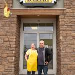 Sequim Gazette photo by Emily Matthiessen/ Laura Shaw stands with husband Tom Shaw outside her Donuts, Cakes and More Bakery at 171 W. Washington St. in Sequim. She also owns Pies, Cakes and More in Port Angeles.