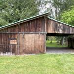 Sequim Gazette photo by Matthew Nash/ This garage/barn is included in the Gerhardt Park surplus auction by the City of Sequim. City councilors agreed last September to surplus the buildings rather than pay up to $150,000 for demolition to see if the public would be interested in the wood from the outbuildings and moving a house to be renovated.