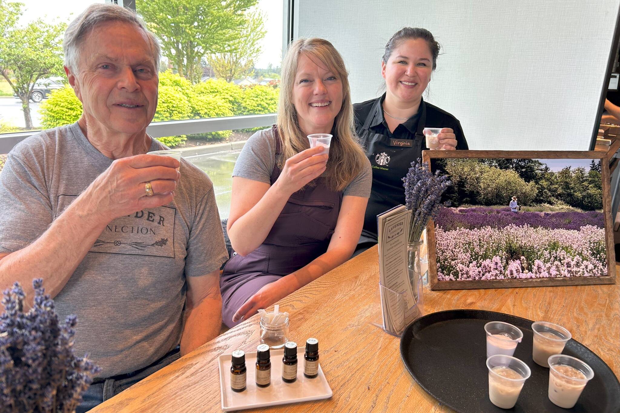 Sequim Gazette photo by Matthew Nash
Father and daughter Rick and Rebecca Olson, co-owners of Lavender Connection, sit with Virginia Brady, Sequim Starbucks store manager, on May 17 for an event where the farmers shared essential oils with customers to smell from their farm. Starbucks beverage developers visited their farm in 2023 and used their experience and farm products as inspiration for lavender drinks sold worldwide.