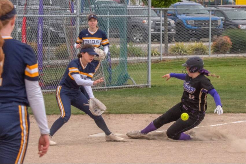 Sequim Gazette photo by Emily Matthiessen
Sequims Grace Gardner beats the throw and slides safely into third base with a triple during the Wolves 10-2 win over Bainbridge on May 14.