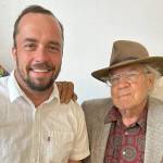 Sequim Gazette photo by Matthew Nash/ Derrick Eberle of Eberle Farm stands with his neighbor Nash Huber on May 17 at a benefit dinner/concert. Eberle said hes known Huber his entire life and feels he has preserved a lot of farmland through leasing property. It gives owners a reason to keep farming, he said.
