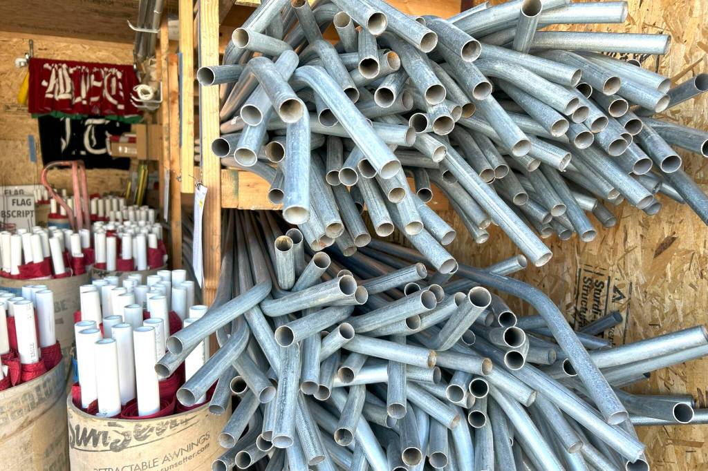 Sequim Gazette photo by Matthew Nash/ More than 600 American flags and metal poles are stored in a donated unit for Sequim Sunrise Rotarys Flag Subscription Program.