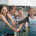 Photo by Selene Dorkin
Sequim Middle Schools 4X400 team of Emme Henrickson, Matilda Woodbury, Eleanor Jones and Alabama Evenson, celebrate winning the event on the Olympic League Meet on May 20 in Sequim.