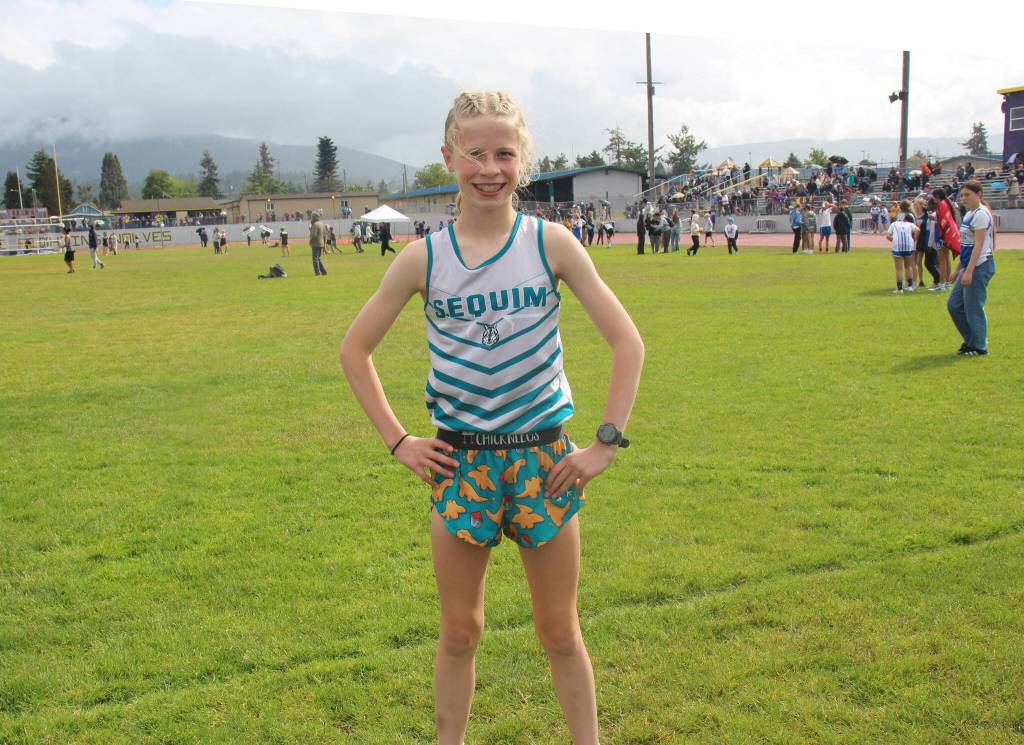 Photo by Selene Dorkin/ Eleanor Jones broke the school record for the 800-meter run in 2:31.15, and the 1600-meter in 5:!5.22 at Sequim Middle Schools last track meet of the year. According to coach Caleb Gentry, her time is third in state for all seventh graders in Washington, and eighth fastest for all middle school girl runners.