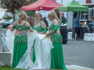 Sequim Gazette photo by Emily Matthiessen
Laura Samperi-Ferdig, Sequims leader of the Peninsulas only belly dance troupe, Shula Azhar, smiles as the troupe prepares for a dance at the Juan de Fuca festival in Port Angeles last Friday.