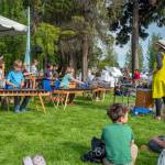 Sequim Gazette photo by Emily Matthiessen/ Rosie Sharpe, arts and music teacher at Five Acre School of Sequim, leads students in a marimba song at the Juan de Fuca Festival in Port Angeles last Friday. Marimba is a musical instrument in the percussion family that consists of wooden bars that are struck by mallets. Below each bar is a resonator pipe that amplifies particular harmonics of its sound.