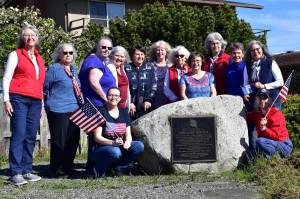 Photo courtesy New Dungeness Chapter DAR/ To celebrate the formation of a new chapter of Daughters of the American Revolution in Sequim, many of the organizing members met for a photo at the New Dungeness historical marker at the corner of Marine Drive and Clark Road. They are, from left: Charlotte Elkins, Darlene Cook, Tammie Cochran, Donna Olson, Krista Johnson, Judy Nordstrom, Pam Grider, Anita Reynolds, Marianne Burton, Carol Medlicott, and Mona Kinder. Those in the front row are Monica Reynolds (left) and Lorri Gilchrist.