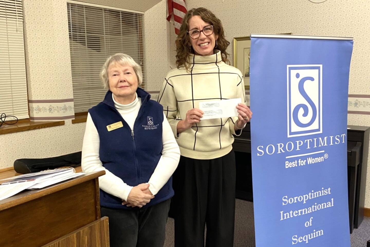 Photo courtesy of Sequim Soroptimists
Kayla Oakes, right, of Field Arts & Events Hall, accepts a donation of $10,000 for Peninsula Performs from Soroptimist International of Sequim Finance Chair Jeanne Martin. Field Arts & Events Hall offers the innovative program, which will connect art providers with students and educators in the Sequim School District. The curriculum-based arts integration approach incorporates music, dance, theater, and visual arts into learning and aligns with both the Common Core State Standards and the National Core Arts Standards.