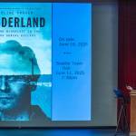 Photo by Emily Matthiessen/ Author Caroline Fraser reveals to a local audience the cover image for her new book Murderland: Crime and Bloodlust in the Time of Serial Killers shortly before its June release.