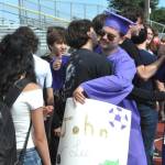 Sequim Gazette photos by Matthew Nash/
John Lee gives a hug to a fellow Sequim High Schooler on June 6 near the end of the Grad Walk.