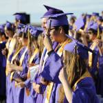 After receiving their diplomas, Sequim High Schools Class of 2025 stands and moves their tassels to the left side of their caps to signify theyve graduated.