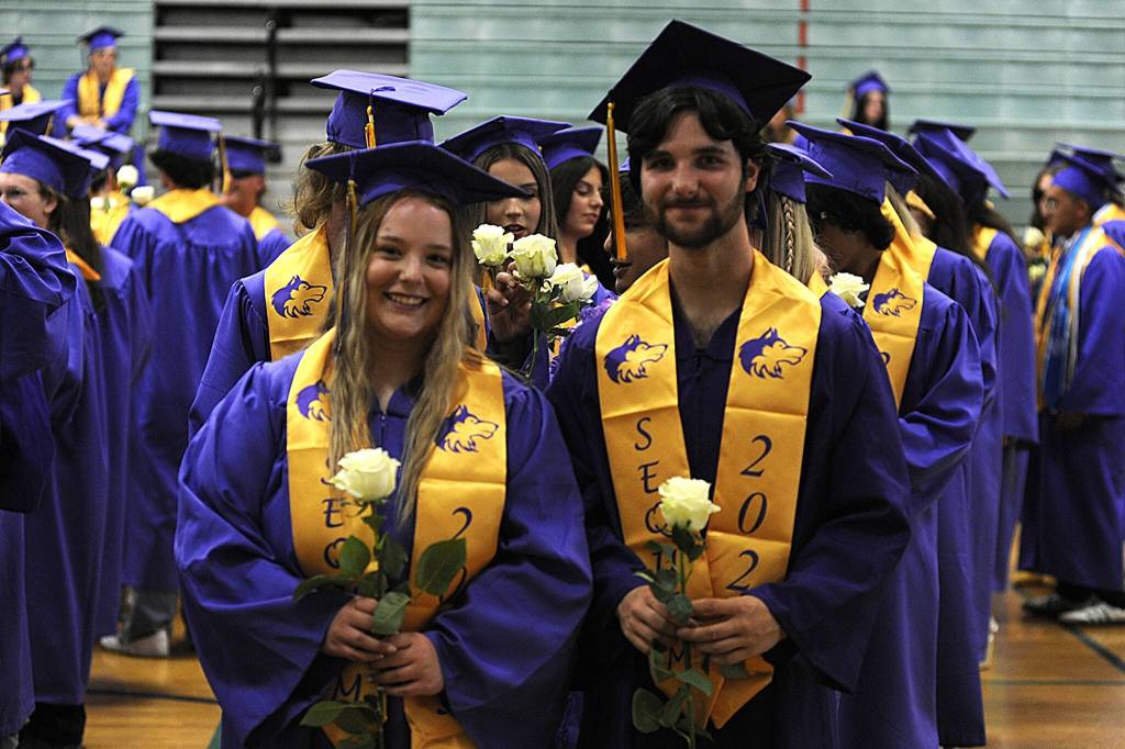 Sequim Gazette photo by Matthew Nash/ Mariah Stringer and Aeidon Crear line up with fellow graduates in the Sequim Middle School gymnasium as they await the walk to their graduation ceremony.