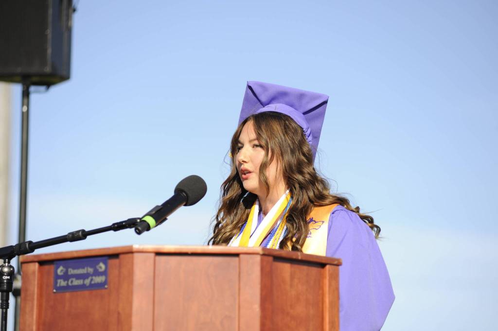 Sequim Gazette photo by Matthew Nash/ Melia Nelson, one of six valedictorians, urged fellow graduates not to become satisfied with chasing one goal, solving one part of your identity (but) to become a fully realized person, a well-rounded member of society. I urge you to stay curious, always ask questions, search for new experiences for knowledge and be open to finding joy that is all around you, Nelson said.