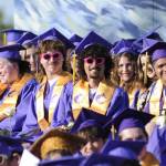 Asher Bascue and Nekadius Scouller sport fun shades while listening to staff speaker Bill McFarlen at graduation.
