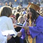 Kansas Jackson happily accepts her diploma from Sequim School Board director Patrice Johnston.