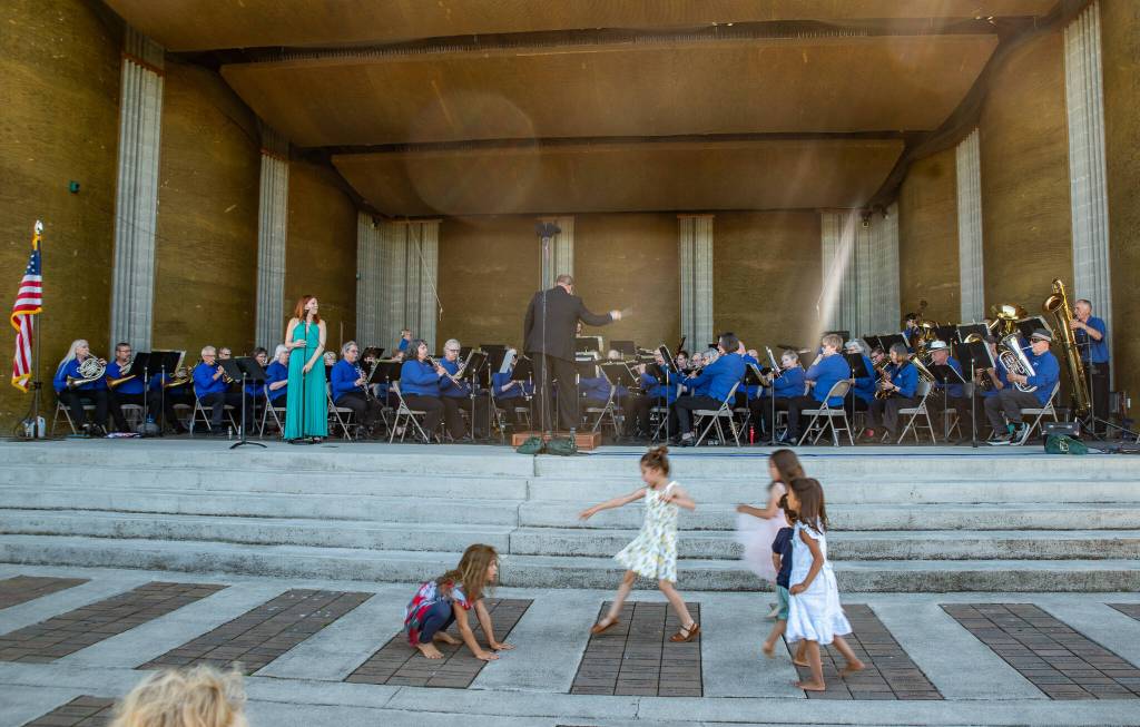 Sequim Gazette photo by Emily Matthiessen/
At the James Center for the Performing Arts band shell in Carrie Blake Community Park on Sunday afternoon, the Sequim City Band combined forces with dancers from Sequim Ballroom Dance, guest musicians, singer Sarah Shea, Olympic Theatre Arts David Herbelin and an enthusiastic audience of people and dogs who braved the heat to enjoy an outdoor concert.