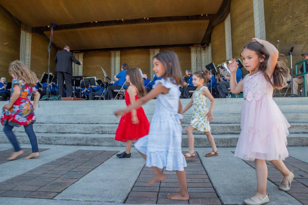 Sequim Gazette photo by Emily Matthiessen/
At the James Center for the Performing Arts band shell in Carrie Blake Community Park on Sunday afternoon, the Sequim City Band combined forces with dancers from Sequim Ballroom Dance, guest musicians, singer Sarah Shea, Olympic Theatre Arts David Herbelin and an enthusiastic audience of people and dogs who braved the heat to enjoy an outdoor concert.