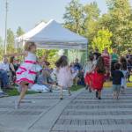 Sequim Gazette photo by Emily Matthiessen/
At the James Center for the Performing Arts band shell in Carrie Blake Community Park on Sunday afternoon, the Sequim City Band combined forces with dancers from Sequim Ballroom Dance, guest musicians, singer Sarah Shea, Olympic Theatre Arts David Herbelin and an enthusiastic audience of people and dogs who braved the heat to enjoy an outdoor concert.