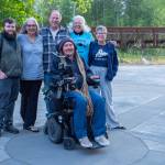 Photo by Emily Matthiessen/ Ian Mackay, in wheelchair, spoke at the Dungeness River Nature Center on Thursday, June 12, in company with some of the important people in his life, from left: Jesse Major, photographer and administrative assistant for the nonprofit Ians Ride; Teena Woodward, writer, Ians Ride director and Mackays mother; Russ Woodward, Mackays stepfather and wheelchair mechanic; Beverly Dawson, Mackays grandmother; and Karen Polinsky, author of Ians Ride: A Long-Distance Journey to Joy.