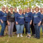 Photo by Emily Matthiessen/ Some of the 19 members of the womens barbershop Grand Olympics Chorus pose for a group photo outside their headquarters near QFC in Sequim during last weeks rehearsal wearing their Most Improved Chorus necklaces won at the Sweet Adelines Region 13 contest in Spokane in May. Group members said they have plenty of room for more singers in the chorus, and those interested are welcome to attend a Monday evening practice, either to observe or sing with them.