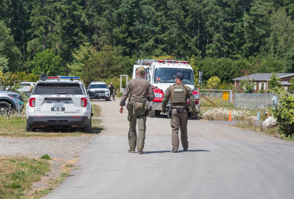 Sequim Gazette photo by Emily Matthiessen/ Clallam County Sheriffs Office deputies arrested Justin Cox, 37, at about 11:30 a.m. Tuesday, ending a situation that began with an 8:04 a.m. call from a local business about a man behaving erratically and claiming to be armed.