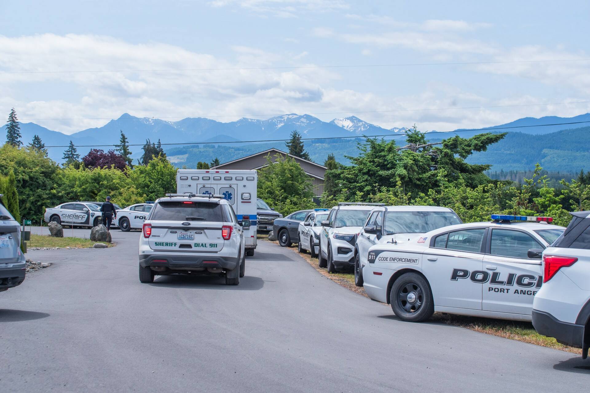 Sequim Gazette photo by Emily Matthiessen/ Dozens of law enforcement first responder vehicles assisted with the arrest of Justin Cox on June 17 after he allegedly shot at officers and bystanders sheltering in place inside a home.