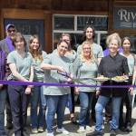 Photo courtesy Sequim-Dungeness Valley Chamber of Commerce/
Ambassadors with the Sequim-Dungeness Valley Chamber of Commerce join Riverhouse Bakery & Bistro for a ribbon cutting on Friday, June 20, to celebrate their new dinner service offered from 4-8 p.m. on Friday and Saturday. Owner Denise Ferguson, surrounded by her staff, holds plates containing the bistros new Salmon Wellington and an open-face steak sandwich. Guests were invited to sample menu items, including steak gorgonzola alfredo.