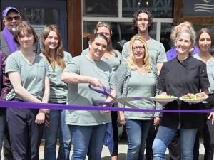 Photo courtesy Sequim-Dungeness Valley Chamber of Commerce/
Ambassadors with the Sequim-Dungeness Valley Chamber of Commerce join Riverhouse Bakery & Bistro for a ribbon cutting on Friday, June 20, to celebrate their new dinner service offered from 4-8 p.m. on Friday and Saturday. Owner Denise Ferguson, surrounded by her staff, holds plates containing the bistros new Salmon Wellington and an open-face steak sandwich. Guests were invited to sample menu items, including steak gorgonzola alfredo.