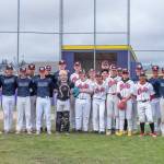 Photo by Emily Matthiessen/ Baseball teams Wilder Junior and the World Baseball Showcase junior team Colts Gray pose for a group photo after a long game on Friday morning, June 27, in Sequim. Wilder Junior is made up of players from Sequim, Port Angeles and Forks who try out and then play over the summer around the state. The Colts are made up of international players, including players from the USA, Australia, Dubai and Hong Kong. While in the area for four days, Colts players are hosted in local homes. Some years local players play for the Colts as well.