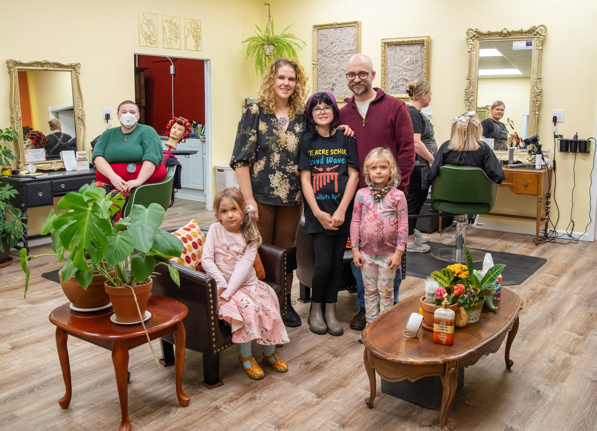 Sequim Gazette photos by Emily Matthiessen
Little Shop of Hairdos owner Talia Landau, in the center, with the help of her family transformed a former ceramics studio in Carlsborg into a thriving beauty salon. Along with apprentice Kimmy Jackson and stylist Sarah Fueschel, she is busy every day the shop is open.