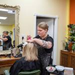 Sequim Gazette photo by Emily Matthiessen/ Stylist Sarah Fueschel at work in the Little Shop of Hairdos.