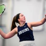 Photo courtesy George Fox University
Sequim High alum Kalli Wiker prepares to make a hit in a match in March playing for George Fox University. In her four years with the school, she won 104 career matches.