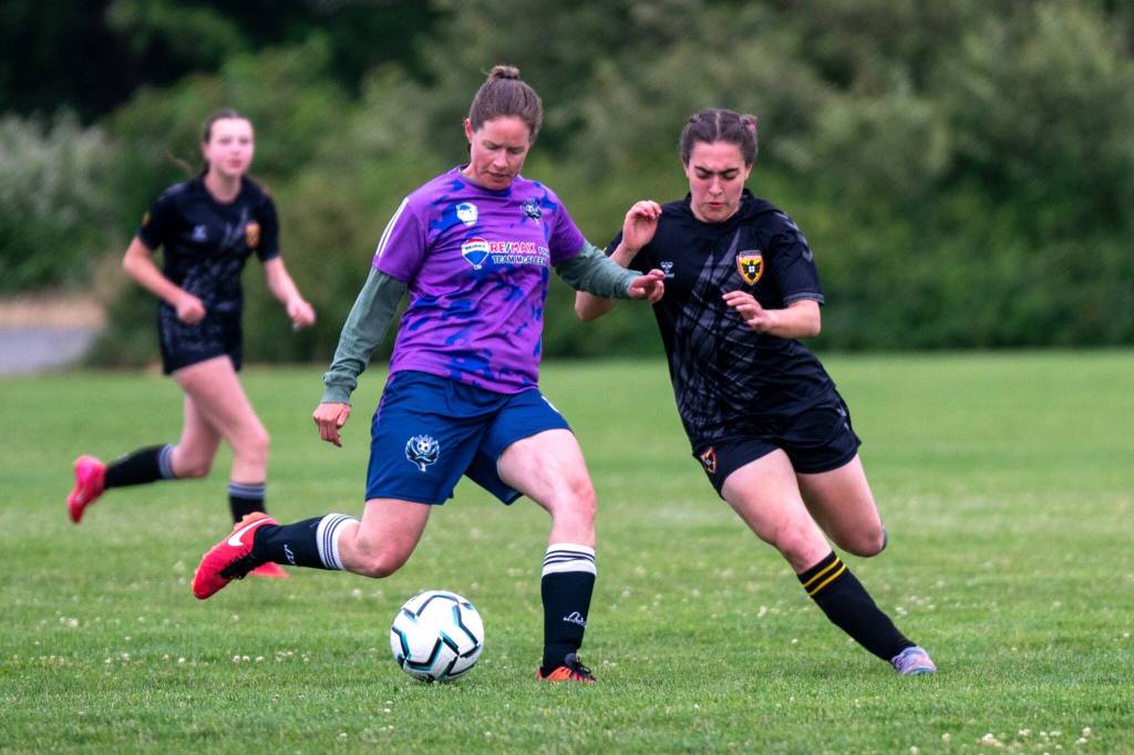 Photo by Devin Beck/ Aliina Lahti kicks the ball to a teammate on June 19 at the Albert Haller Playfields. She and the Northern Peninsula Football Club womens team Blaze won 6-0 against the St. Paul U19 Blackhawks.