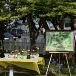 Photo courtesy of Sequim Prairie Garden Club/ Suzan Mannisto, co-manager of Pioneer Memorial Park, introduces the Pathway Accessible to All Project recently as Sequim Irrigation Festival Prince Malachi Byrne looks on.