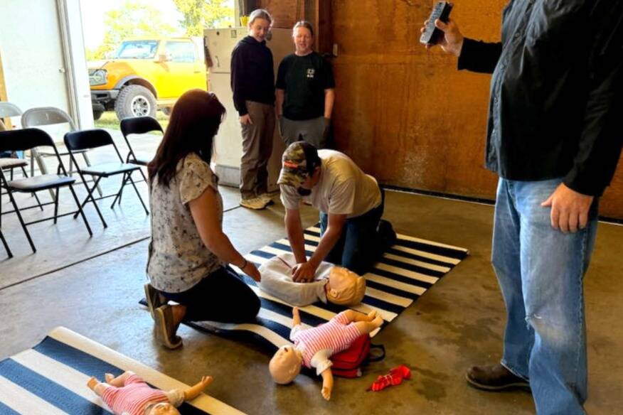 Photo courtesy of Clallam County Fire District 3/ Whether its behind the wheel of a fire engine, on a mountain bike at a community event, or in a classroom teaching CPR, C-Shift leads - quietly, consistently, and with unwavering pride, according to C-Shift Battalion Chief Elliot Jones. Here, 4H Club members learn CPR.