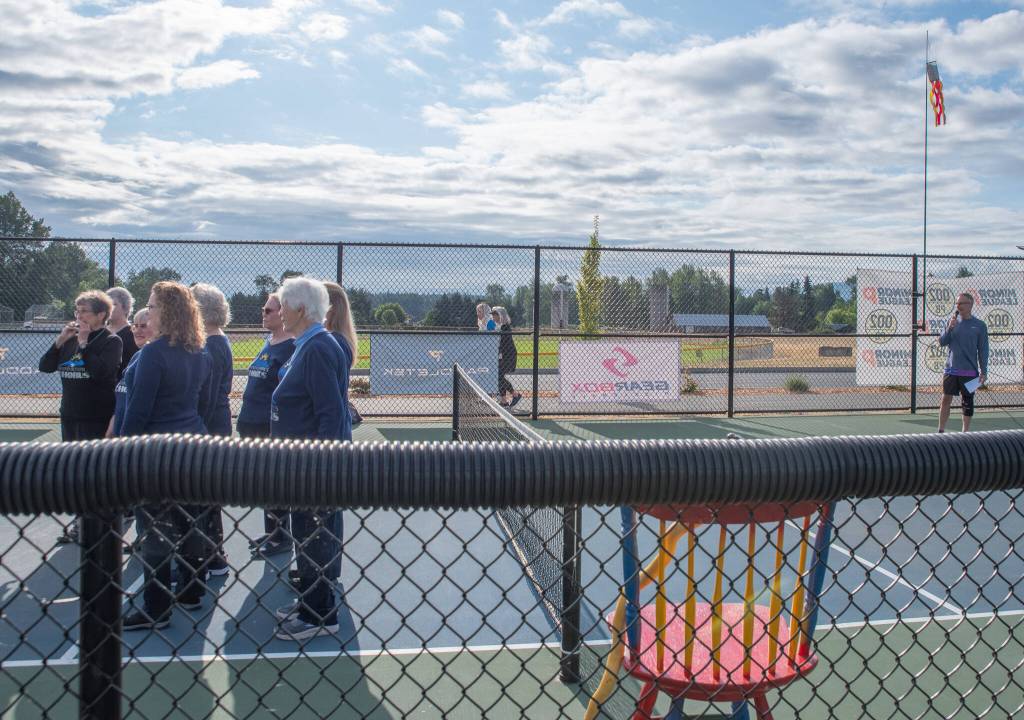 Sequim Gazette photo by Emily Matthiessen/ The Grand Olympics Chorus sang the national anthem at the beginning of Fridays round of competitions in the Sequim Fling.