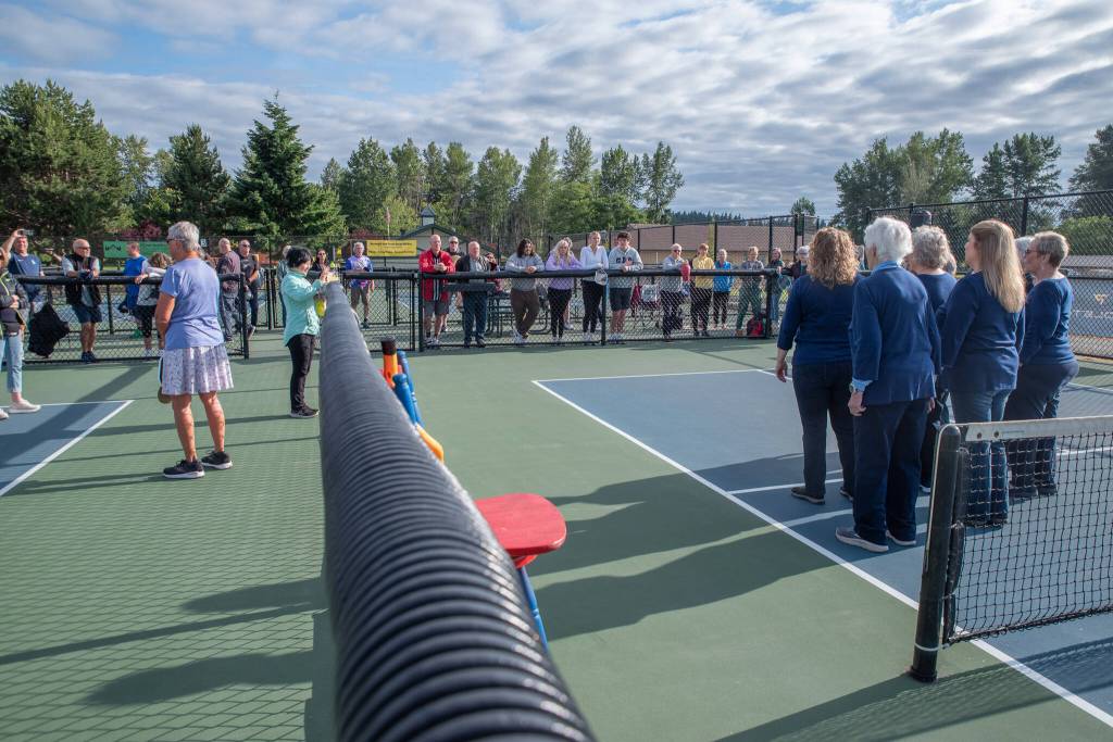 Sequim Gazette photo by Emily Matthiessen/ The Grand Olympics Chorus sang the national anthem at the beginning of Fridays round of competitions in the Sequim Fling.